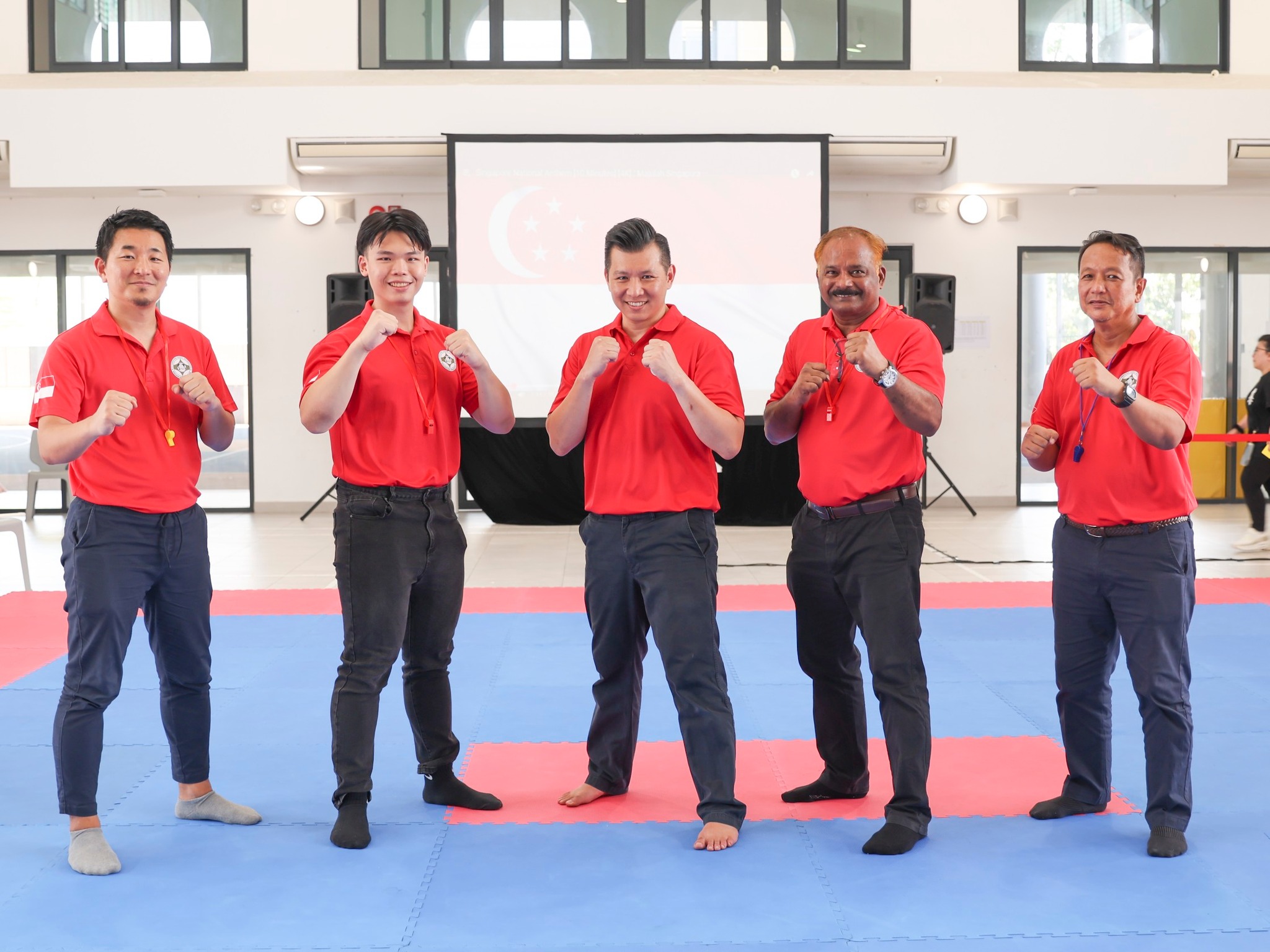 I.K.O.N Kyokushin Singapore committee members in red polos