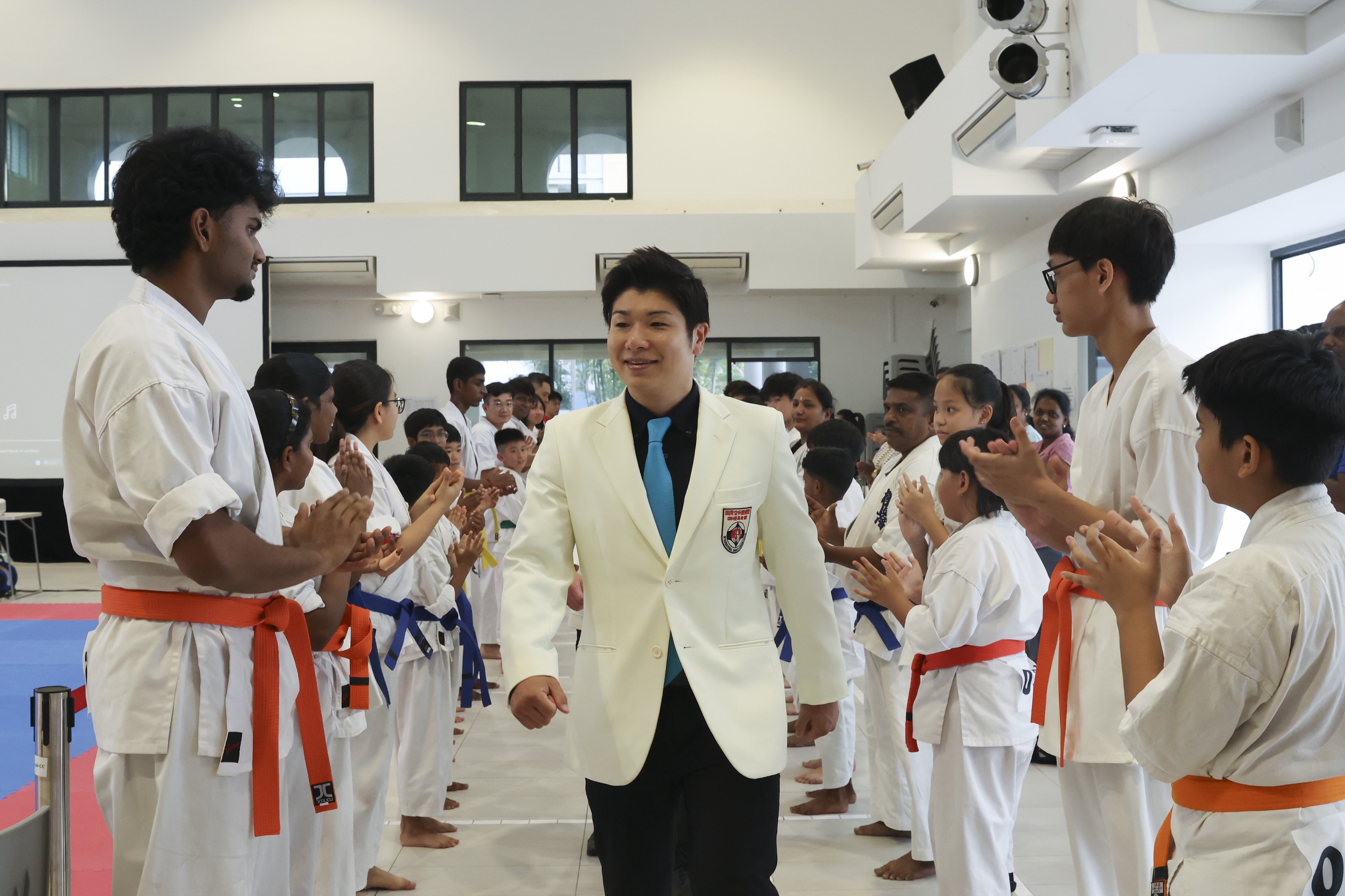 Daihyo Masanaga Nakamura walking to the stage at the Singapore Karate Classic