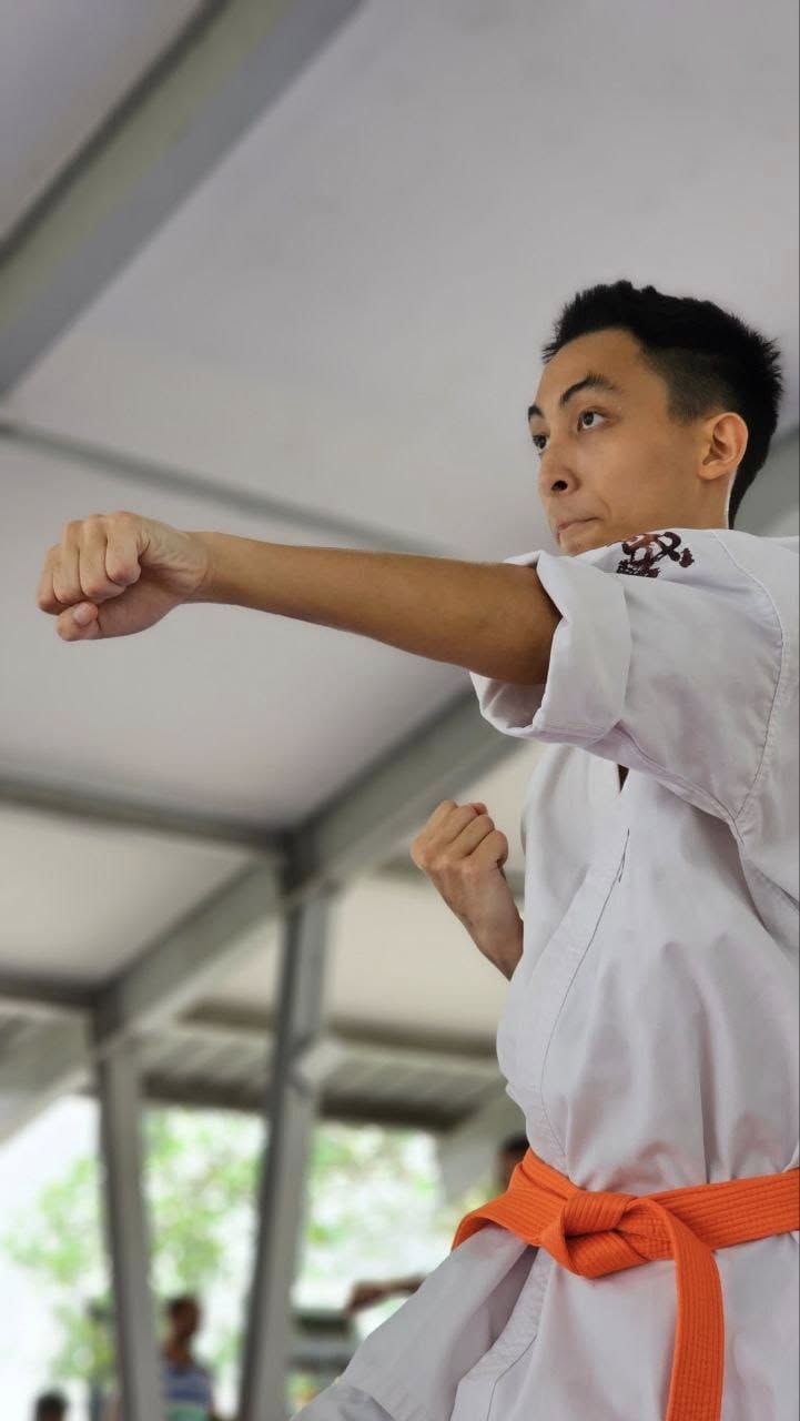 Karateka delivering a confident punch